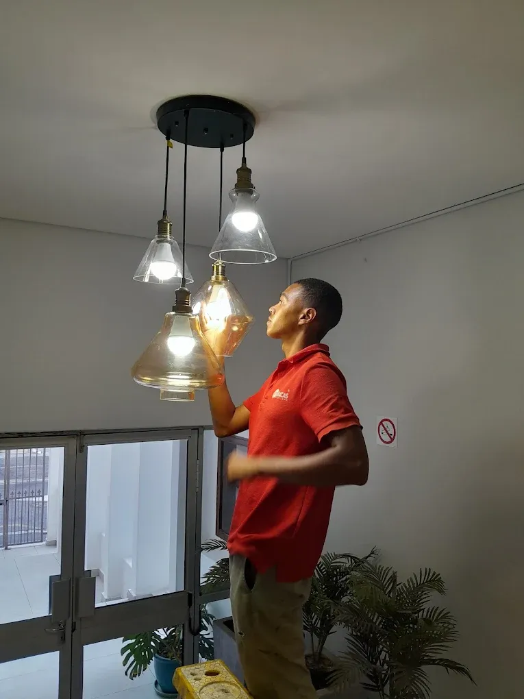 Abacas electrician installing modern pendant lights in Western Cape home