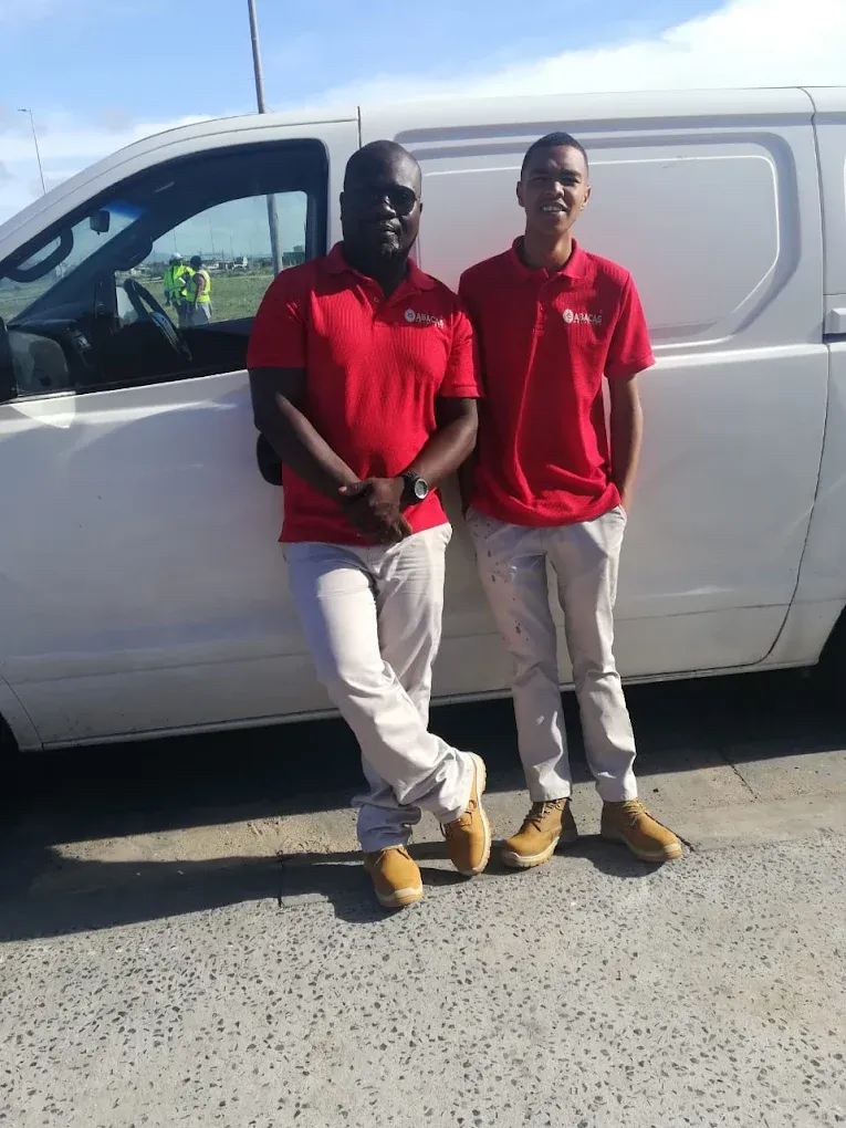 Abacas Solution team in branded uniforms next to service van in Western Cape